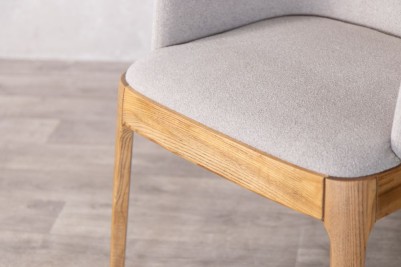 calais carver chair light grey wood closeup